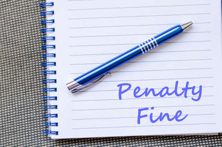 Penalty fine text concept write on notebook with penの写真素材