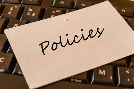Policies - note on keyboard in the officeの写真素材