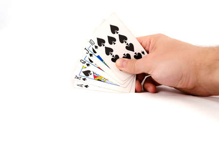 Playing cards in hand isolated on white background