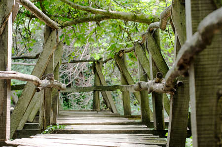 Old small bridge through a riverの写真素材