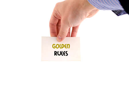 Golden rules text concept isolated over white backgroundの写真素材