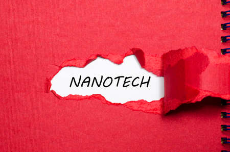 The word nanotech appearing behind torn paperの写真素材