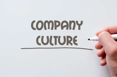 Human hand writing company culture on whiteboardの写真素材