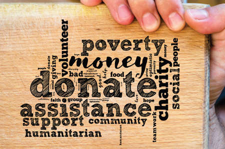 Donate word cloud collage with human handの写真素材