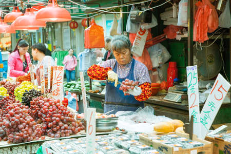 Fruit seller in the street market, Hong Kong, February 17, 2014.