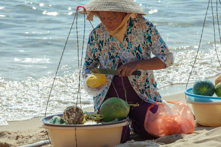 Phu Quoc, Vietnam - 07 April, 2014: Fruit vendor on the beach of Phu Quoc Island, popular tourist...