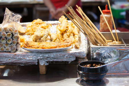 Korean street food: gimbap rolls and fritters at the night street stall, Seoul, South Korea.の写真素材