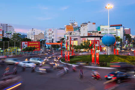 Nha Trang, Vietnam - December 23, 2015: Dusk view of the busy traffic circle in the center of Nha Trang city on December 23, 2015, Nha Trang, Vietnam.のeditorial素材