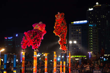 Nha Trang, Vietnam - February 02, 2016: Acrobats perform lion dance show during  dance competitions commemorated to the Chinese New Year celebrations in Nha Trang, Vietnam on February 02, 2016.のeditorial素材