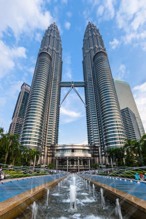 Kuala Lumpur, Malaysia - March 14, 2016: Front view of the famous Petronas Towers in a sunset light, Kuala Lumpur, Malaysia on March 14, 2016.のeditorial素材