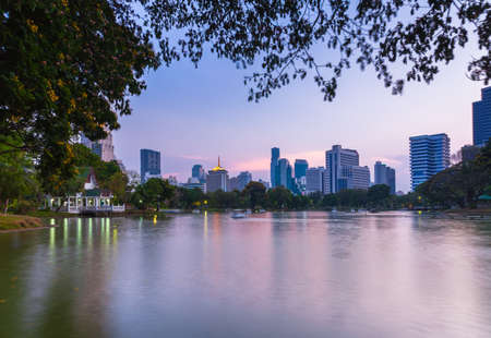 Sunset view of Bangkok skyline in Lumpini public park, Bangkok, Thailandのeditorial素材