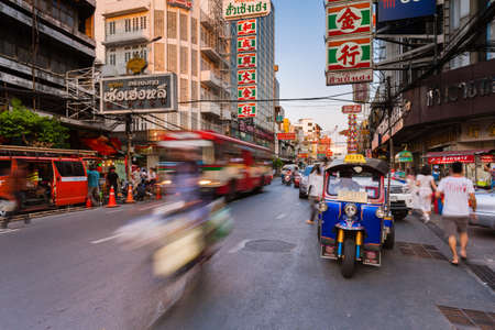 Bangkok, Thailand - April 24, 2016: Tuk-tuk taxi parked near street market in Chinatown on April 24, 2016 in Bangkok, Thailand.のeditorial素材