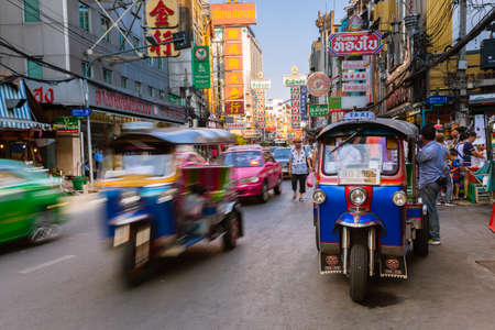 Bangkok, Thailand - April 24, 2016: Tuk-tuk taxi parked near street market in Chinatown on April 24, 2016 in Bangkok, Thailand.のeditorial素材