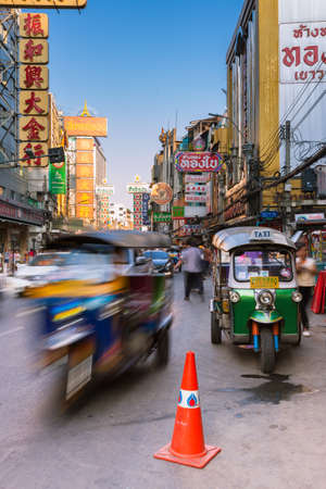 Bangkok, Thailand - April 24, 2016: Tuk-tuk taxi parked near street market in Chinatown on April 24, 2016 in Bangkok, Thailand.のeditorial素材