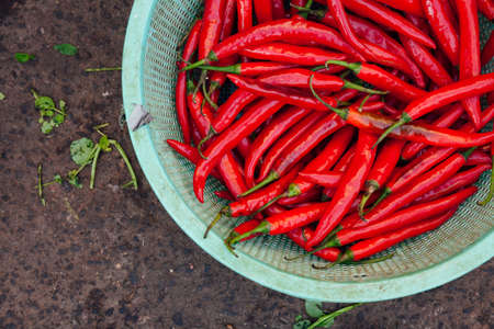 Basket with chili peppers at the street market, Vietnamの写真素材