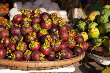 Basket with mangosteen at the street market, Vietnamの写真素材