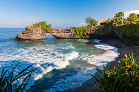 Pura Batu Bolong temple on the beatiful rock in the morning light, Tanah Lot, Bali, Indonesia.のeditorial素材