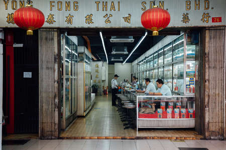 Kuala Lumpur, Malaysia - March 17, 2016: Man buys medicine in traditional Chinese medicine store in Chinatown on March 17, 2016 in Kuala Lumpur, Malaysiaのeditorial素材