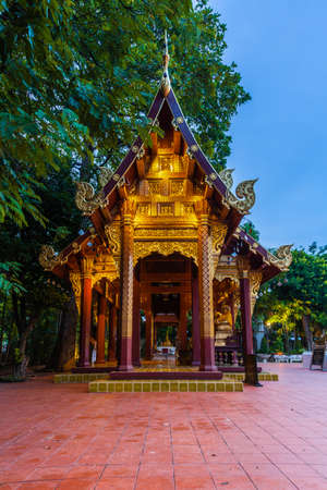 Dusk View of the Wat Phra Singh temple, the most revered temple in Chiang Mai, Thailand.の写真素材