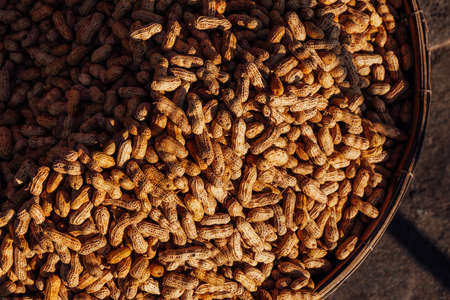 Basket with peanuts at the street market, Vietnamの写真素材