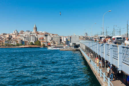 Istanbul, Turkey - August 14, 2018: Men catch fish from the Galata Bridge on August 14, 2018 in Istanbul, Turkey.のeditorial素材