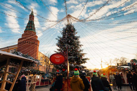 Moscow, Russia - December 20, 2019: People stroll at the Christmas market under the Kremlin walls on December 12, 2019 in Moscow, Russia.のeditorial素材