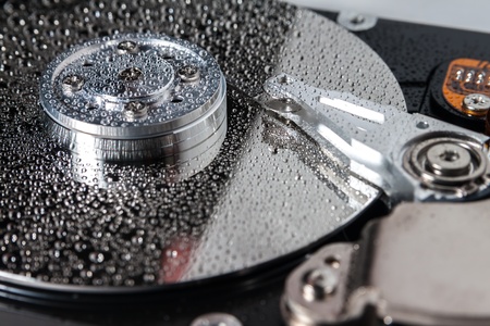 Hard disk drive with water drops.