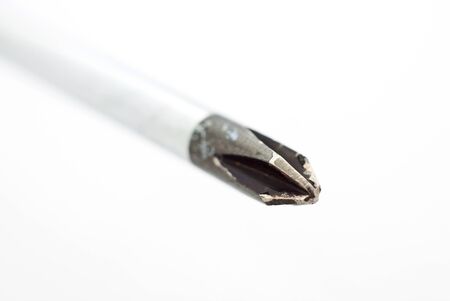 Macro of the tip of a screwdriver on white background. の写真素材
