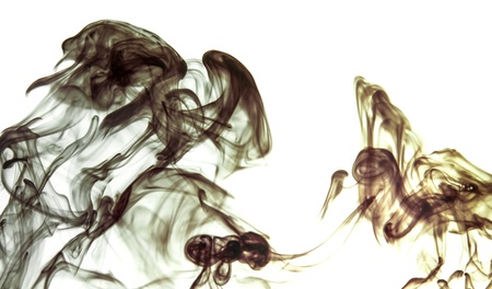 rops of dark ink flowing through water  の写真素材