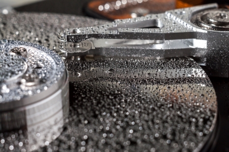 Hard disk drive with water drops. の写真素材