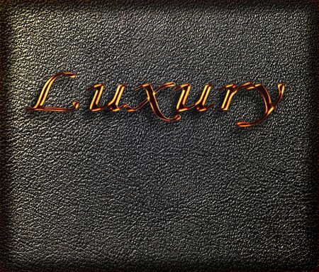 Luxury word in gold shining font on leather background の写真素材
