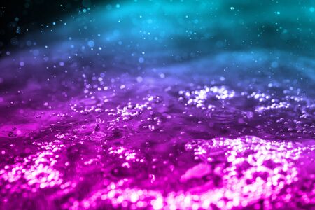 Water drop with blue-pink gradient.の写真素材