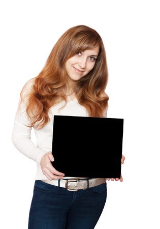 Woman holding blackboard with smiling face isolated on white.の写真素材