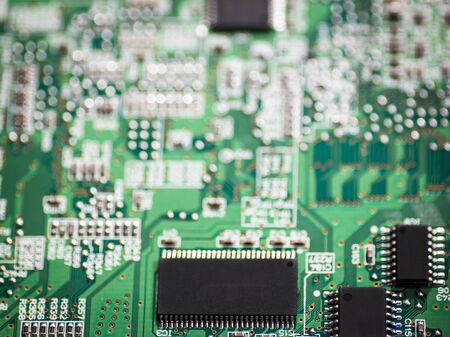 Electronic chip on circuit board with selective focus on chip.