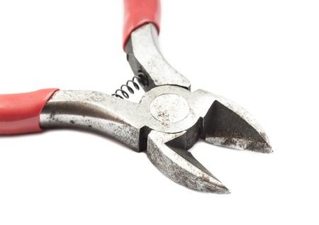 Rusty metal wire cutting pliers close up. Isolated on white.
