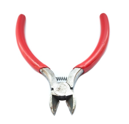 Rusty metal wire cutting pliers on white with shadow.