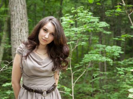 Close-up portrait of a beautiful woman outdoor in the forest.の写真素材