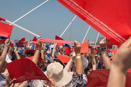 VLADIVOSTOK, RUSSIA - JULY 7: Flashmob "I love Vladivostok" on the "Golden Bridge". It was attended by 26,904 people who   have created a "live" 707-meter Russian flag for 5 minutes for Guinness world record on July 7, 2013 in Vladivostok, Russia. のeditorial素材