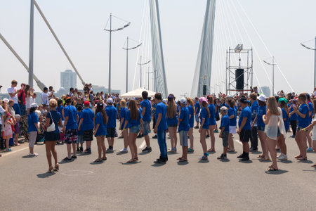 VLADIVOSTOK, RUSSIA - JULY 7: dance Flash mob on the "Golden Bridge". It was attended by hundred people who danced on   the "Golden Bridge" on July 7, 2013 in Vladivostok, Russia. のeditorial素材