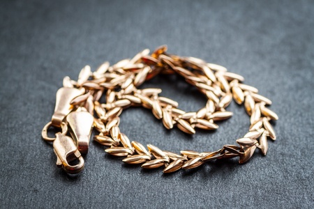     Gold chain on dark background  Macro shot with shallow depth of field  Selective focus  の写真素材