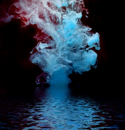Blue ink reflected in water surface  Conceptual photo  の写真素材