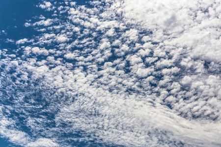   Beautiful blue sky with small clouds  の写真素材