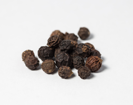 Pieces of black pepper on white  Selective focus with shallow depth of field の写真素材