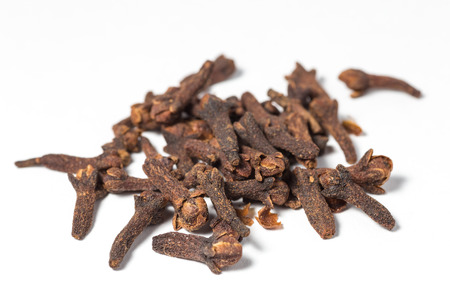 Dry cloves on white .Selective focus with shallow depth of field の写真素材