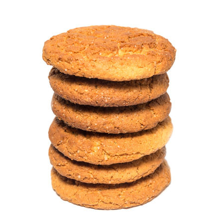  Oat cookies in stack isolated on white   Selective focus with shallow depth of field 