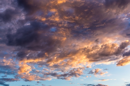  Dramatic sunset with gold colored clouds  