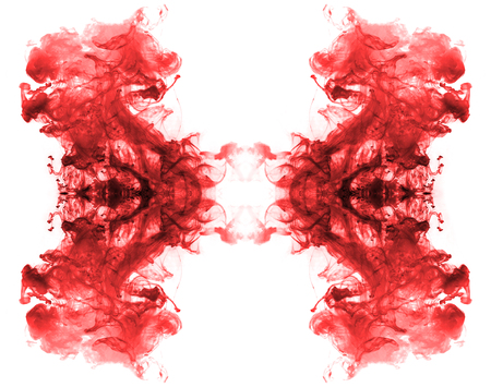  Red ink forming patterns resembling Rorschach Test ink blots の写真素材