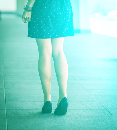    Beautiful, women s legs in shoes  With sunshine effect  の写真素材