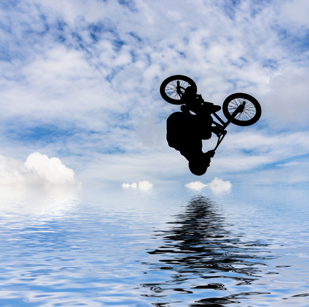  Silhouette of a man doing an jump with a bmx bike  の写真素材