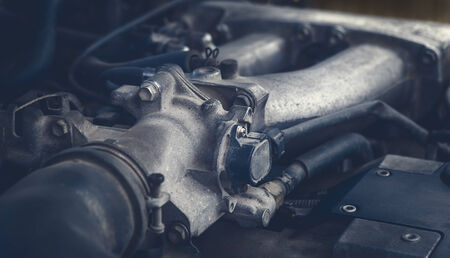 Old and dirty car engine, detail view  Selective focus  Color toned image 